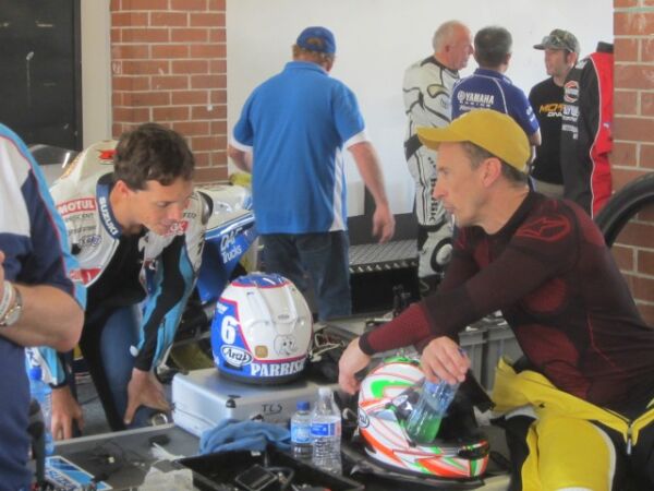 Eastern Creek Australia classic event with Classic Team Suzuki Chris Vermuland talking with Jeremy McWilliams