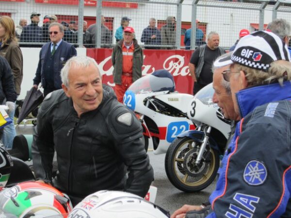 Roberto Galina talking to 8 Times world champion Phil Read and